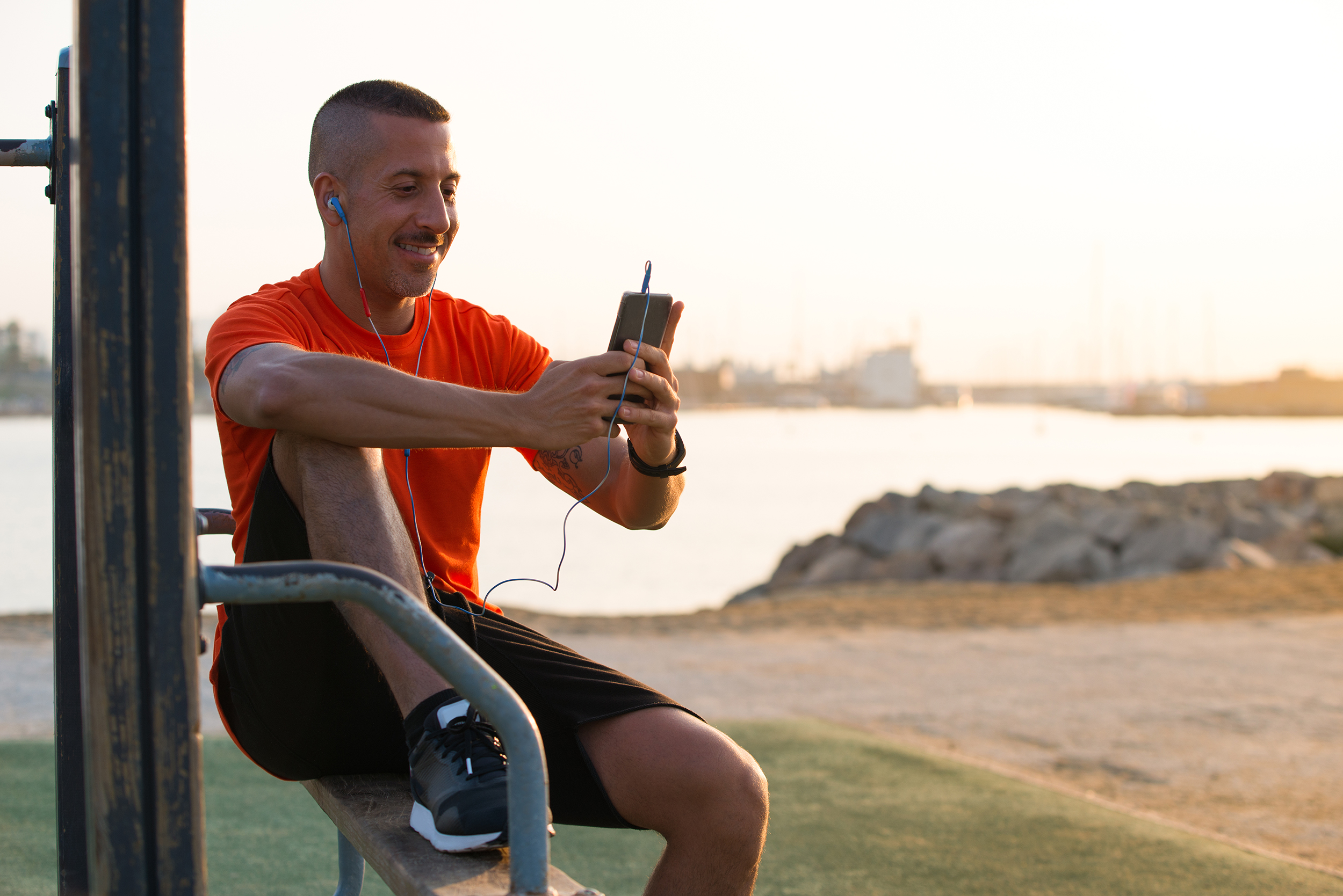 athlete looking at phone